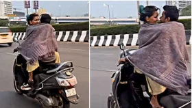 চলন্ত মোটরসাইকেলে চাদরের নিচে চুটিয়ে রোম্যান্স!