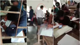 ফোন দেখে লিখছেন পরীক্ষার্থীরা, পাশে দাঁড়িয়ে কক্ষ পরিদর্শক