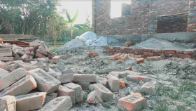 সরকারি সড়কের ইটে হচ্ছে ইউপি সদস্যের ভবন
