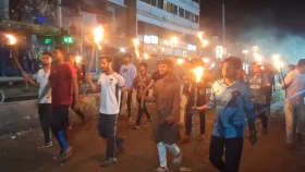 চাঁদাবাজি ও হত্যার প্রতিবাদে জয়পুরহাটে মশাল মিছিল 