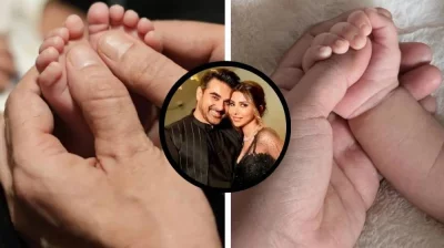 ছোট্ট দুটি পা আগলে রেখেছেন বাবা, মেয়েও বাবার আঙুল শক্ত করে ধরে আছে। ছবি: সংগৃহীত